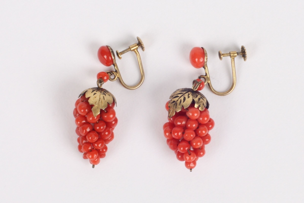 A pair of coral earrings in the form of grapes, the bunch of grapes made up of a cluster of seeds of