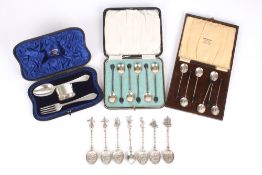 Two sets of silver cased spoons, all with bean handles, together with a cased silver christening set