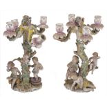 A pair late 19th/early 20th century Dresden porcelain four light candelabra, each modelled as