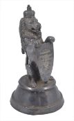 A Victorian silver plated lion inkwell, in seated post and holding a presentation shield with
