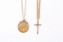 An 1873 Victorian full sovereign in mount on a 9ct gold chain, together with a 9ct gold crucifix