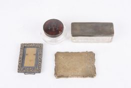 A ladies silver gilt card case, the shaped case heavily engraved with foliate decoration and with