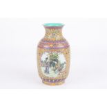 A Chinese Canton enamel vase, 20th century, decorated with a panel of figures in a landscape, the