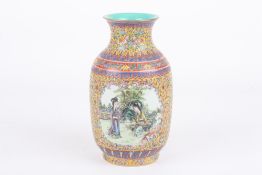 A Chinese Canton enamel vase, 20th century, decorated with a panel of figures in a landscape, the