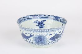 A late 19th century Chinese hand painted bowl, decorated in blue depicting sea urchins and fish to