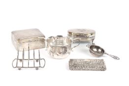 A collection of assorted silver, comprising a silver cigarette box, two trinket boxes, a tea