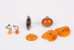 Four pieces of Baltic amber, including a pair of retro cufflinks of asymmetric form, two earrings