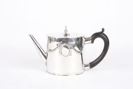 A George III silver teapot, hallmarked London 1770, with swag decoration, leaf finial. and