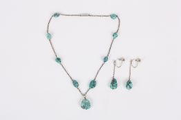 A turquoise and white metal necklace and a pair of similar earrings, the necklace with turquoise