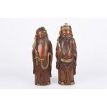 A large pair of 19th century Chinese carved bamboo figures of elders, each decorated with gilt