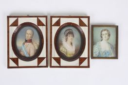 French School, a pair of 20th century oval portrait miniatures of a lady and gentleman in ivory