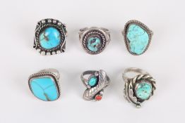 A collection of six turquoise rings, mainly North American, all with white metal shanks, five with