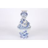 A 19th century Dutch tinglaze blue and white dragon vase, the body painted with a scene of a young