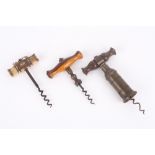 A collection of three 19th century corkscrews, including a Victorian brass patent Thomason style