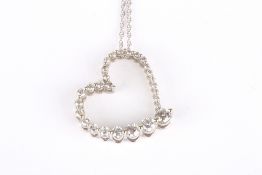 A 14k white gold and diamond heart shaped pendant, comprising 28 brilliant cut graduated diamonds