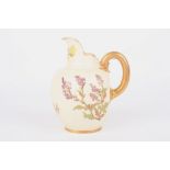 A Royal Worcester blush ivory jug, painted with sprays of flowers and with gilt handle. Mark in puce