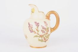 A Royal Worcester blush ivory jug, painted with sprays of flowers and with gilt handle. Mark in puce