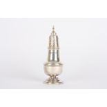 A silver baluster sugar sifter
hallmarked Birmingham 1961, with pierced top and circular foot.