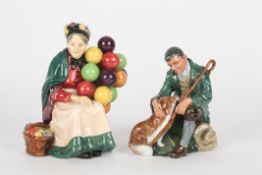 Two Royal Doulton figuresThe Old Balloon Seller HN1315 and The Master HN2325.Dimensions: Balloon