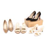 A collection of four pairs of designer shoes.
including two pairs of Christian Louboutin shoes,