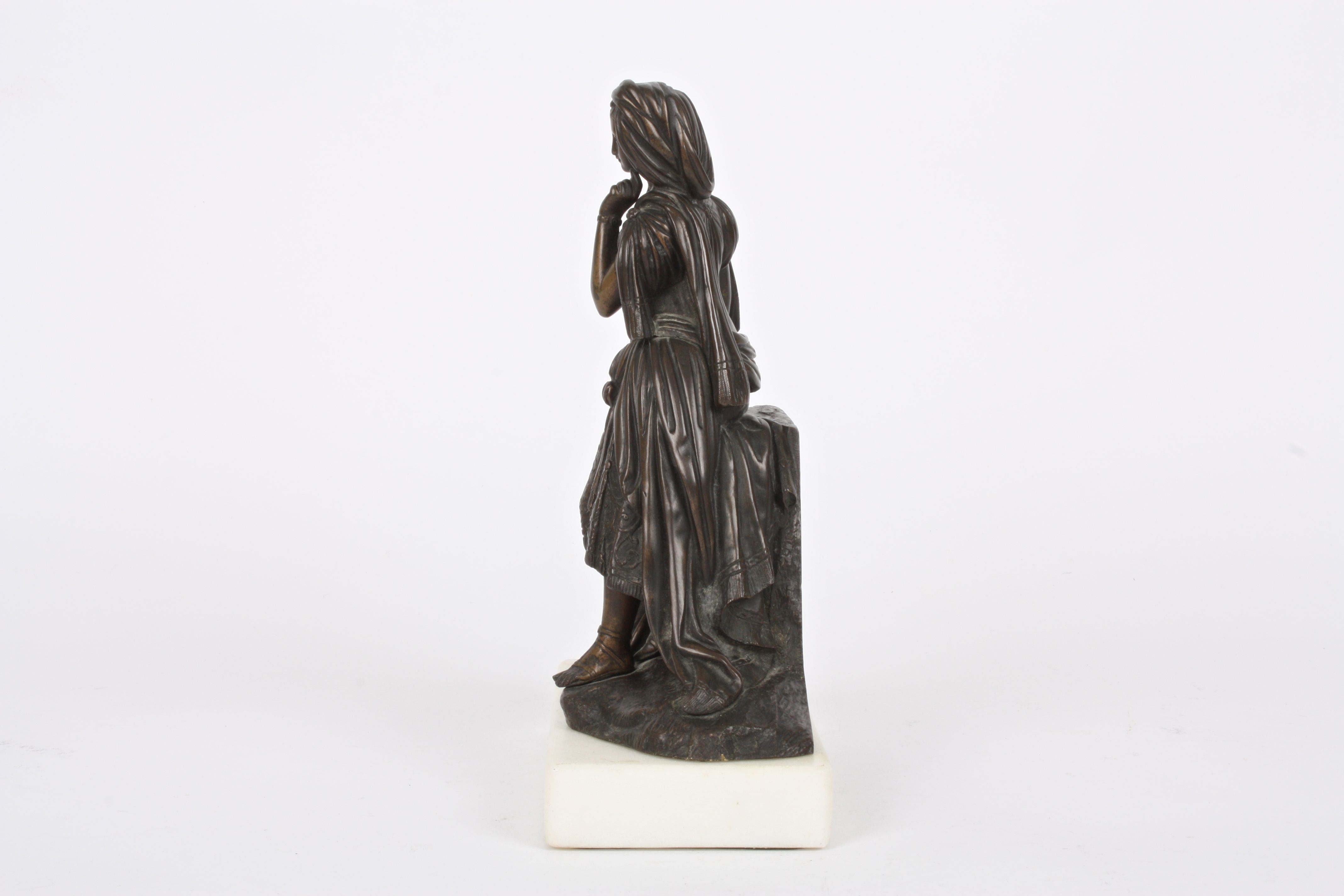 A 19th Century French bronze girl
stood wearing flowing robes stood beside a rocky pedestal and a - Image 2 of 4