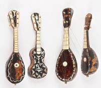 Three 19th century miniature tortoiseshell mandolins and a guitarwith ivory, bone and and another