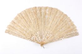 A mother-of-pearl and lace fanwith mother-of-pearl guard sticks and mother-of-pearl and bone