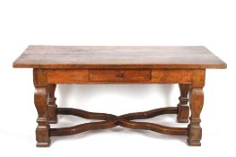 A Continental oak refectory tableprobably 19th century, the plank top over a single small drawer to