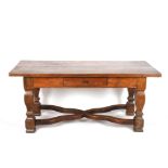 A Continental oak refectory table
probably 19th century, the plank top over a single small drawer to