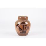 A Moorcroft Mushroom Brown ginger jar and cover
the body and lid decorated with mushrooms on a