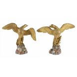 A pair of gilt wood birds
naturalistically carved in flight, on carved wooden basesDimensions: