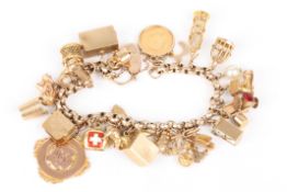 A 9ct gold belcher link charm braceletset with approximately 27 charms including a Victorian half