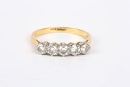 An 18ct gold and diamond five stone ringset with five circular diamond weighing approximately 0.