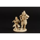 An ivory okimono figure group of two Japanese warriors
late 19th/early 20th century 
one of the