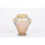 A Louis Comfort Tiffany Favrile iridescent glass vase
of urn shaped form with small loop handles,