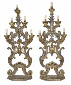 A pair of large carved and decorative gilt wood torcherespossibly late 18th century/early 19th