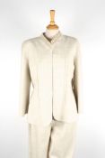 A Valentino trouser suit.light beige suit with open fronted jacket trimmed with beading to collar