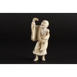 A Japanese ivory okimono figure of a man with a lobster
probably early 20th century
the standing