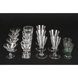 A group of assorted drinking glasses
including five flower engraved cordial glasses, four small