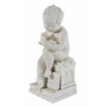 A parian figure of a young boy
seated in a thoughtful pose with one knee bent up, scribing