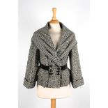 A Louis Vuitton wool jacket.
with herringbone black and white pattern, shawl collar, velvet band