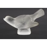 A Lalique frosted glass bird
in crouching pose with wings outswept. Etched signature to base '