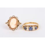 An 18ct gold, diamond and sapphire ring, set with three sapphires interspersed with two smaller