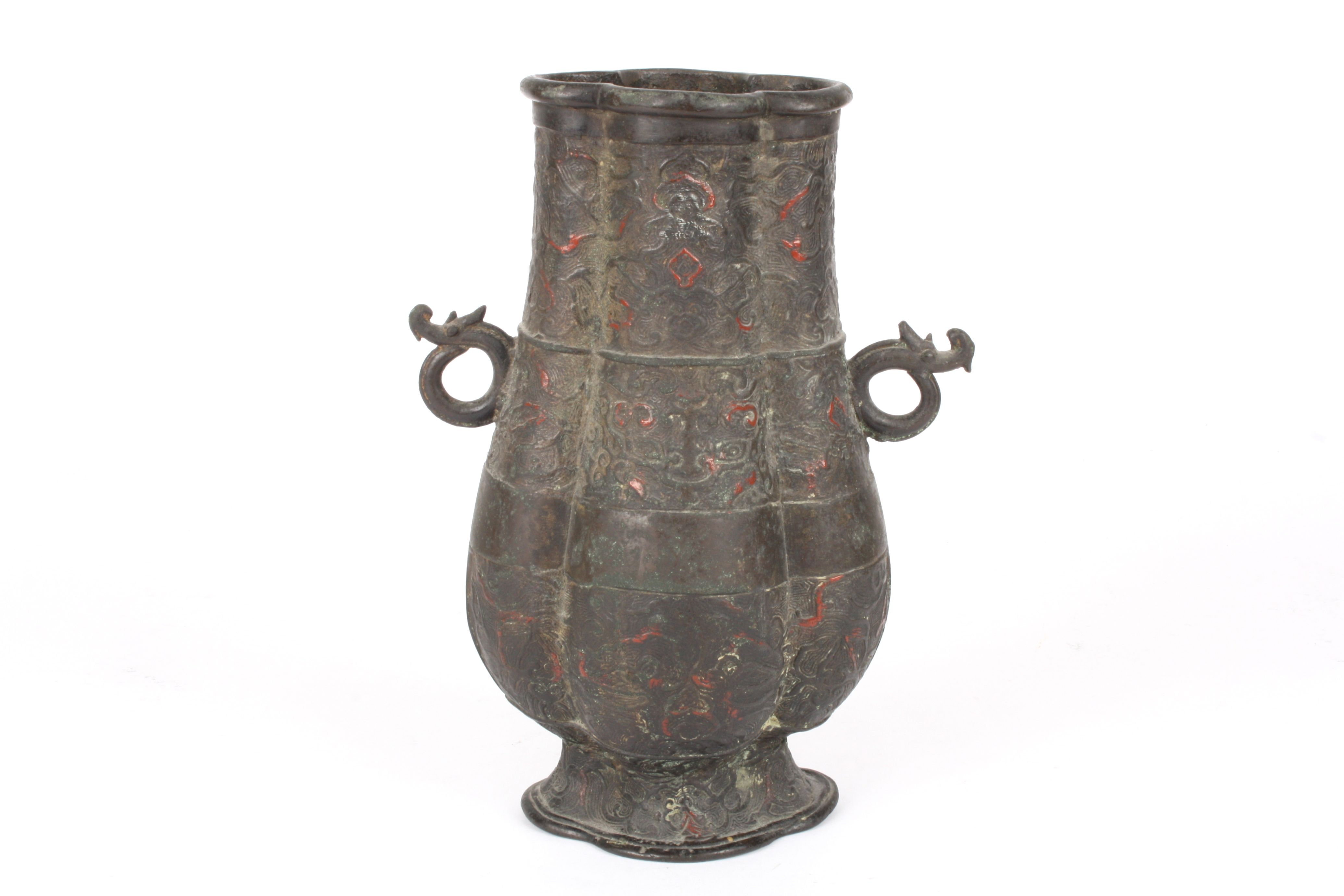 A Chinese bronze and enamel archaic hu vase
18th or 19th century, decorated with bands of scrolls