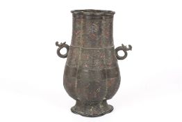 A Chinese bronze and enamel archaic hu vase18th or 19th century, decorated with bands of scrolls