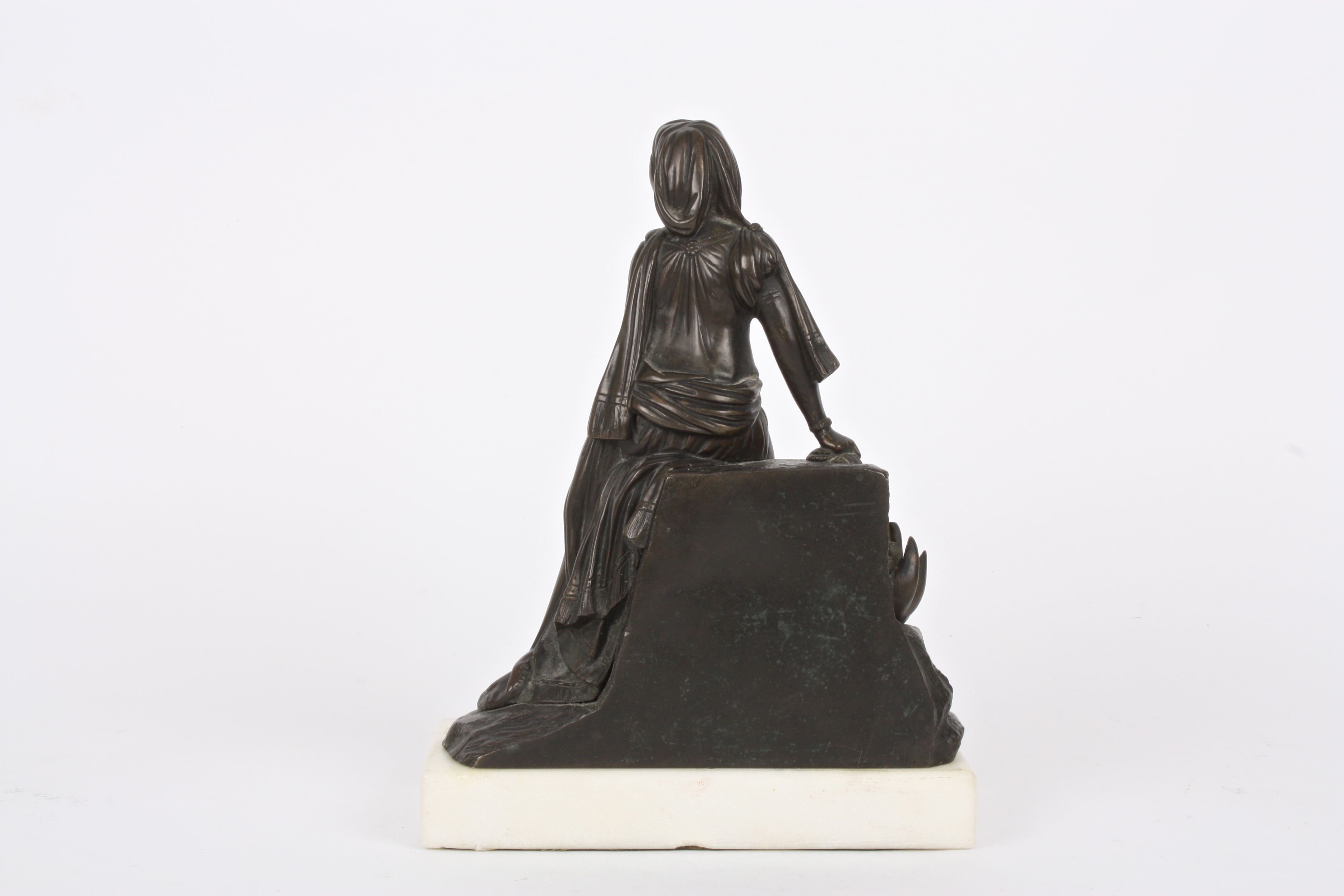 A 19th Century French bronze girl
stood wearing flowing robes stood beside a rocky pedestal and a - Image 3 of 4