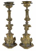 A pair of decorative gilt brass repoussé candlestickspossibly 18th centuryDimensions: height