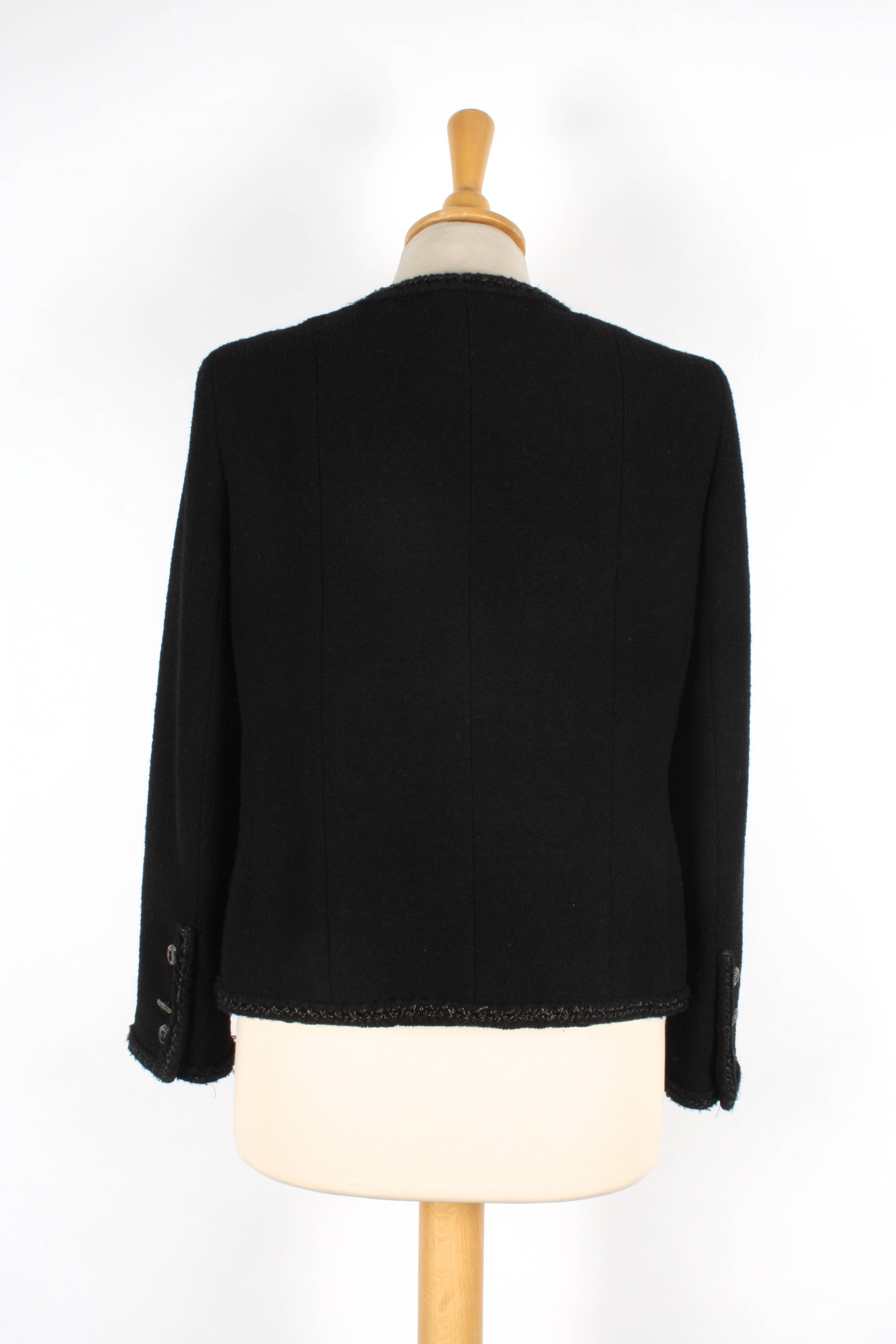 A Chanel black boucle jacket 
with four pockets to front, with braid trim, single breasted, four - Image 2 of 2