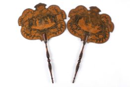 A pair of Regency lacquered chinoiserie fansof paddle form, the shaped wooden fans with central