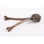A pair of late 19th century novelty nut crackers in the form of a skull and bones
Rd 740410, the